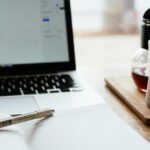 MacBook Pro near white open book