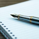 fountain pen on spiral book