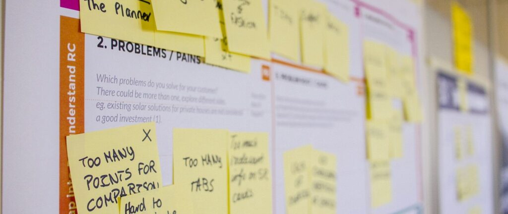 printed sticky notes glued on board